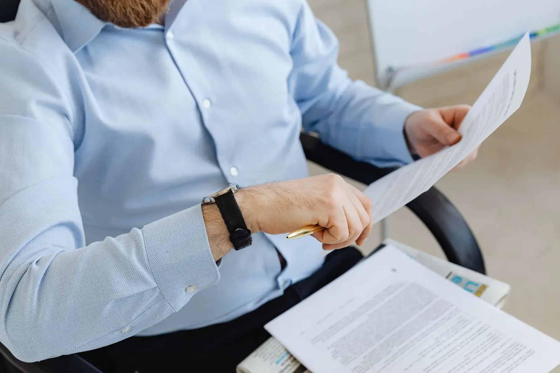 Professionals reviewing compliance documents, representing Edu Accounting & Auditors' business compliance services